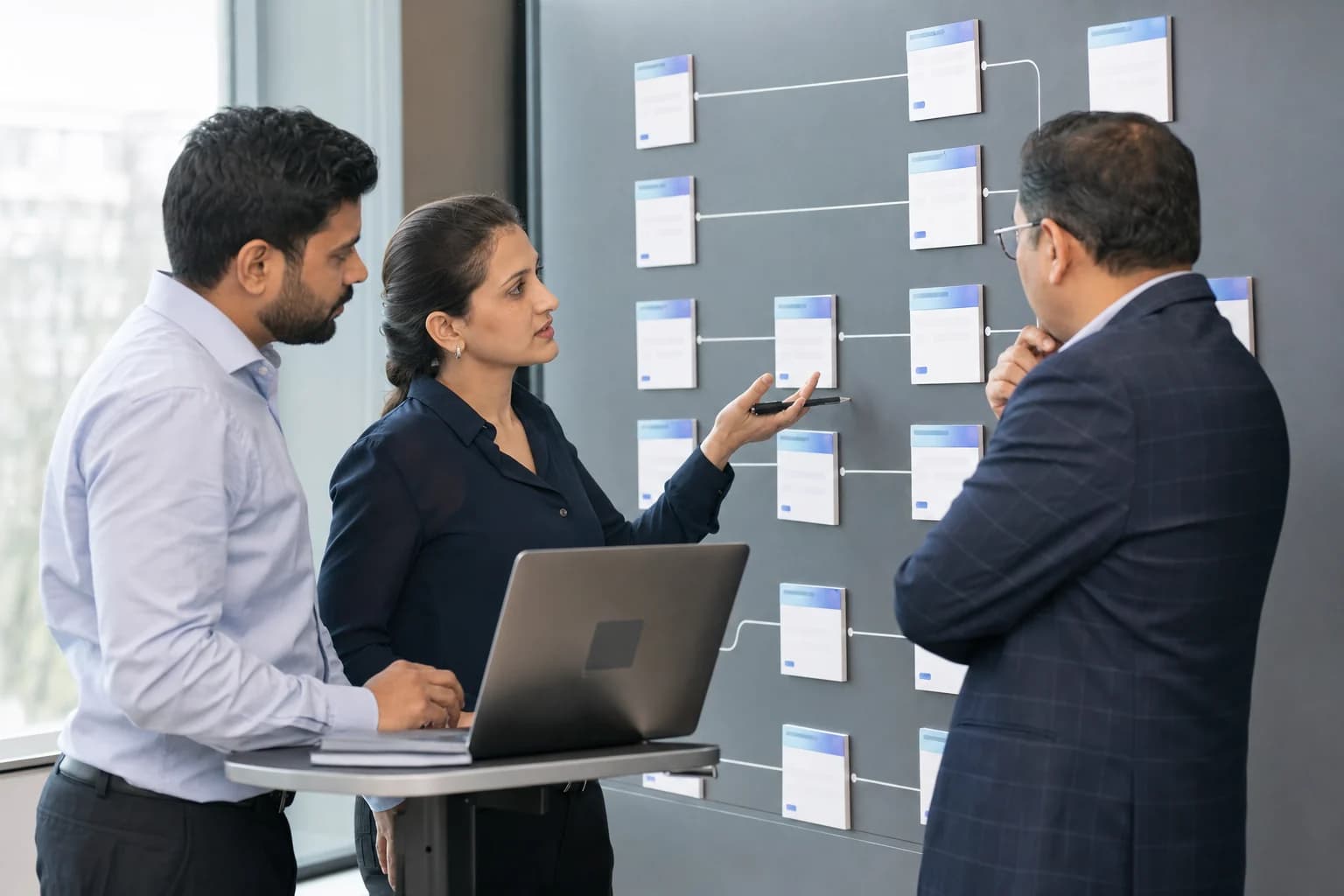 ERP consultants and a business stakeholder reviewing a custom approval workflow